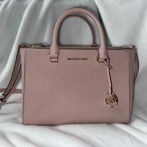 Michael Kors pink handbag. Very lightly,kept stored in a bag. Smoke free home